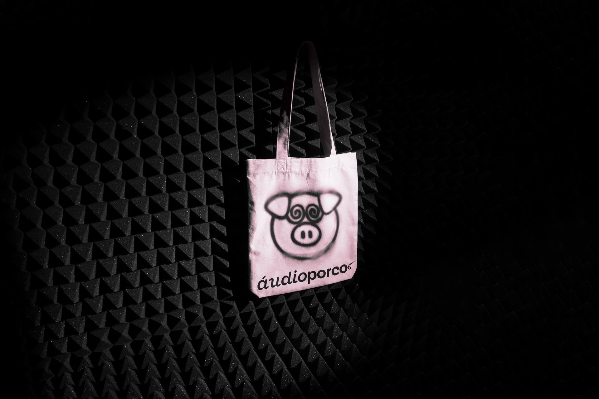 Tote bag hanging in an acoustic foam room