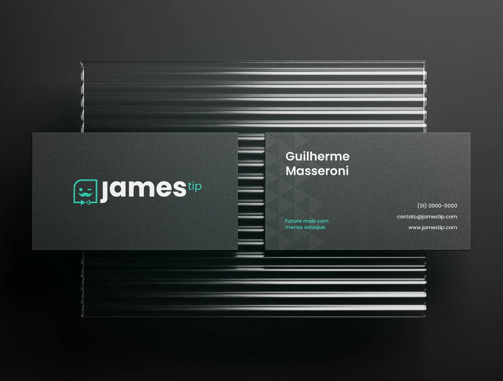 James Tip business cards on a dark ribbed surface