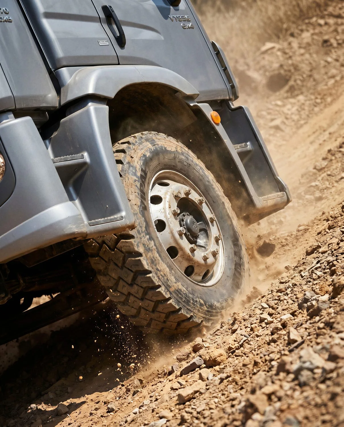 Truck tire biting into a dusty slope