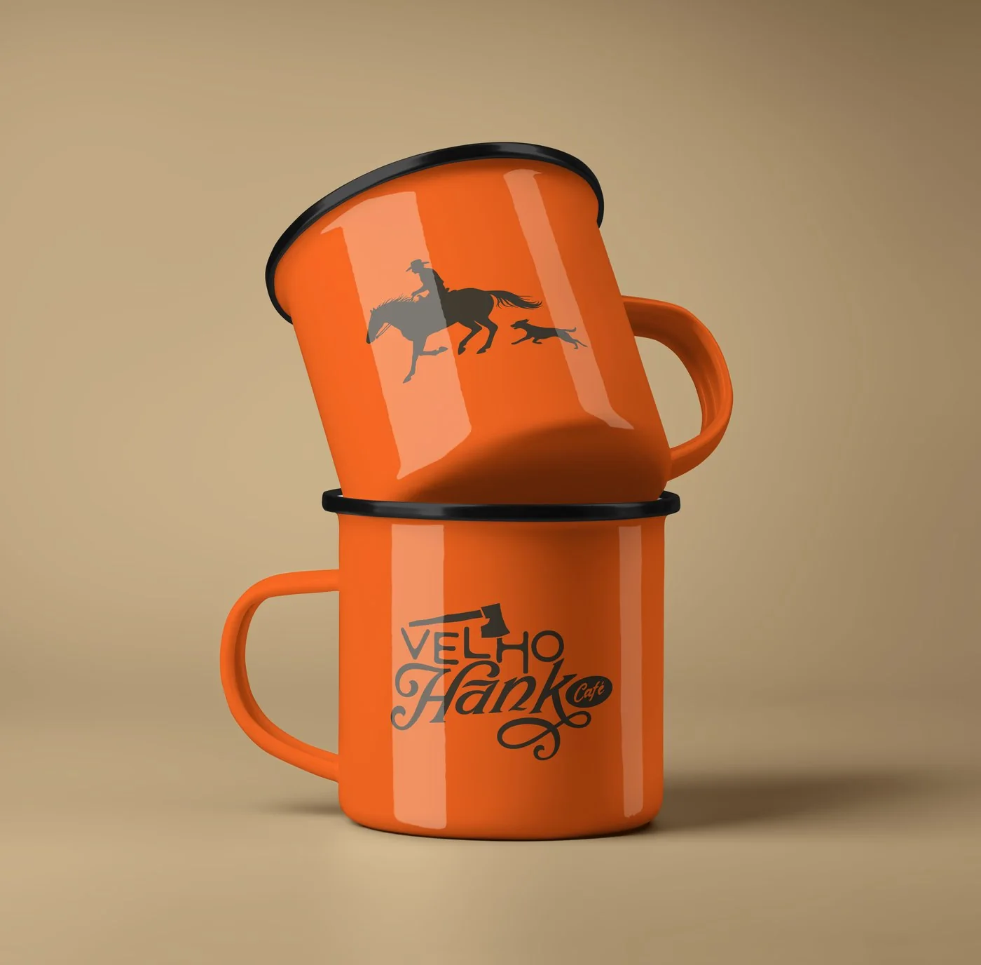 Orange enamel mugs with the cowboy and the Velho Hank logo