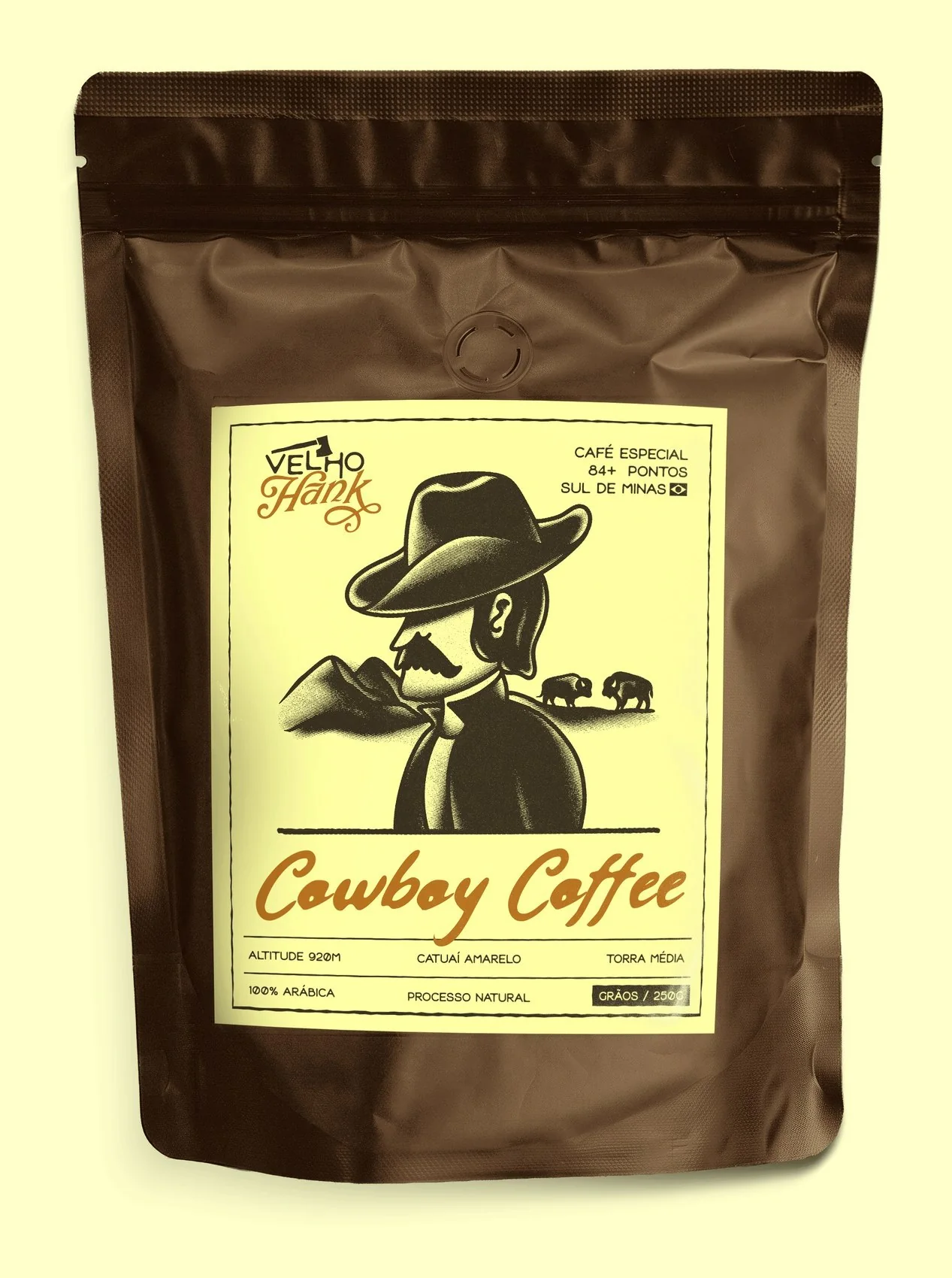 Cowboy Coffee bag with the approved cream label on a wooden shelf