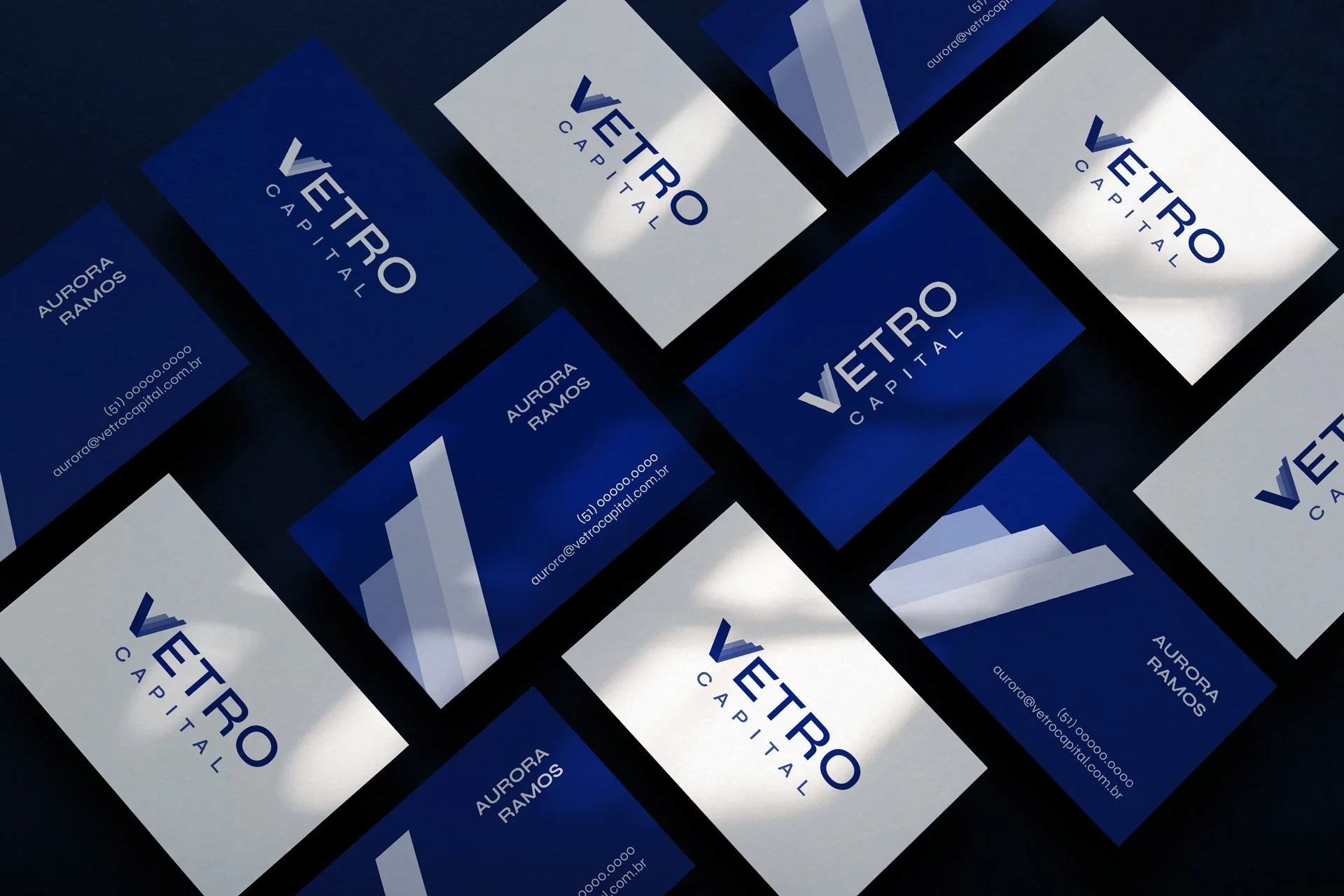Vetro Capital business cards in navy and white