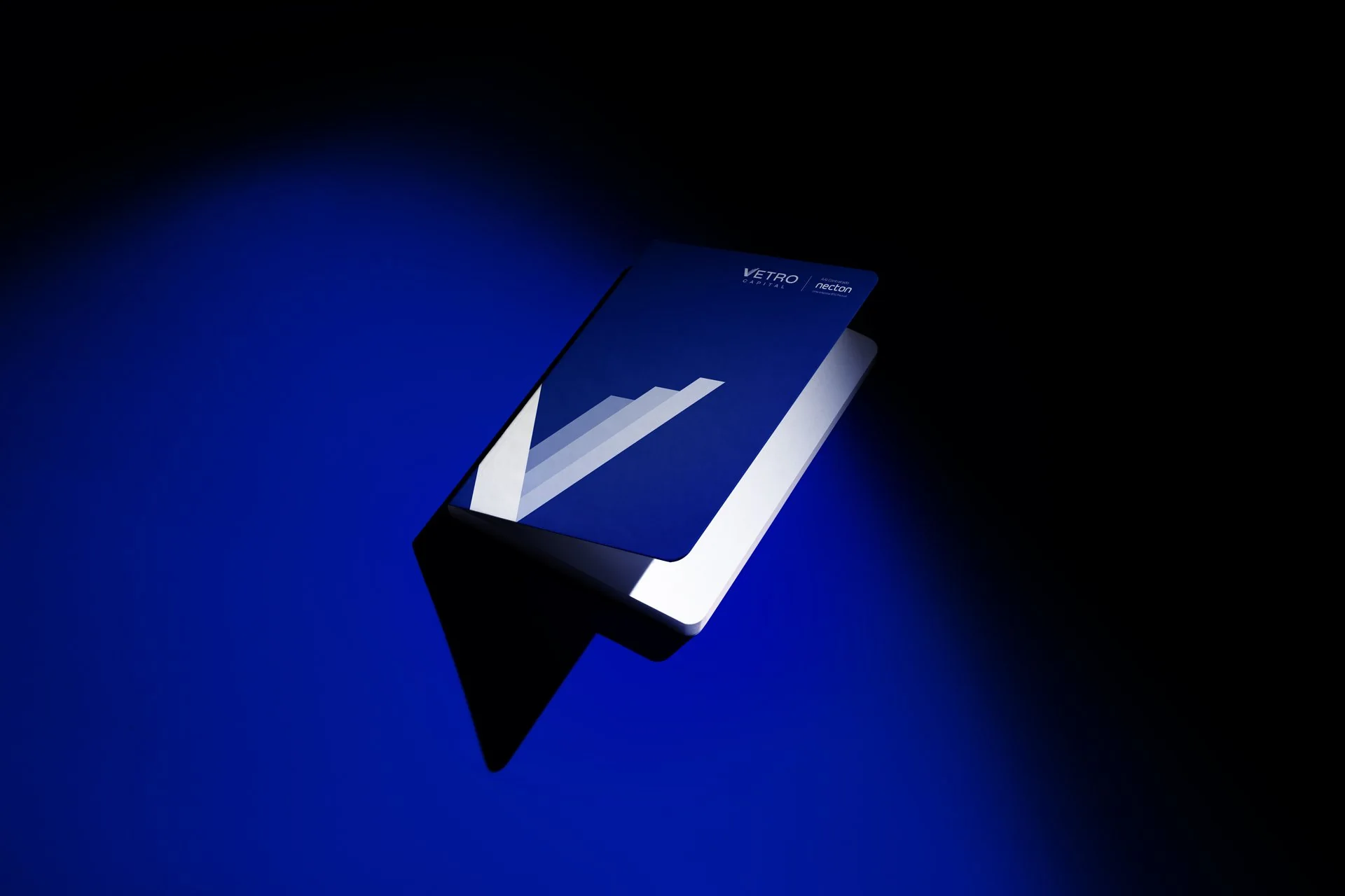 Vetro Capital notebook under a blue spotlight